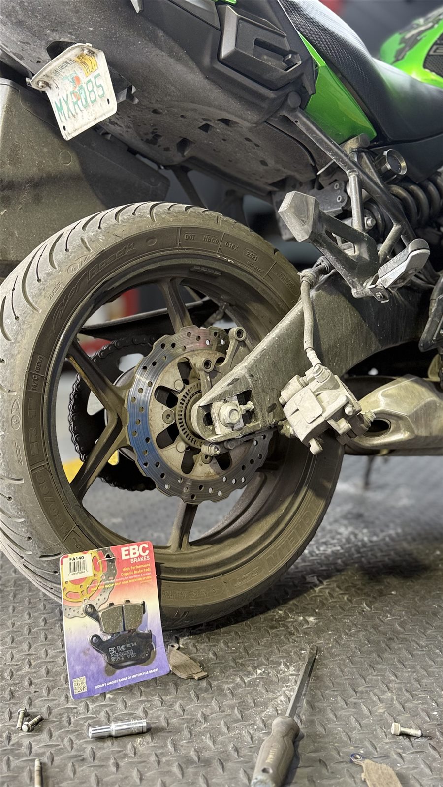 Brake or wheel service being performed by Pulgar Motors.